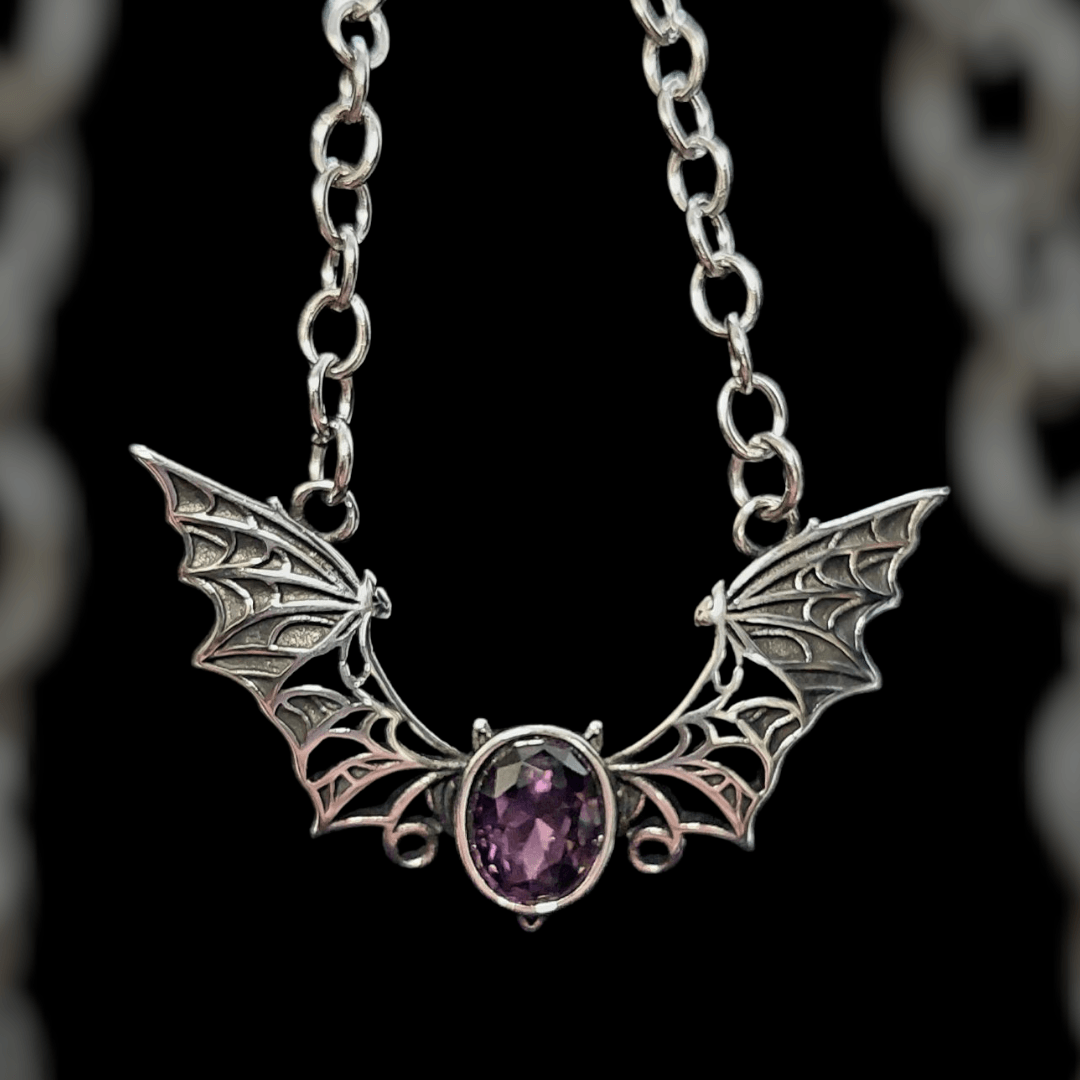 Bat necklace with purple stone