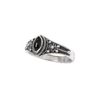 Expertly crafted in classic style, this filigree silver ring features a striking black onyx stone, adding a touch of elegance and sophistication to any outfit. Measuring at approximately 0.9 cm in height, this ring is a timeless accessory that is sure to make a statement. 