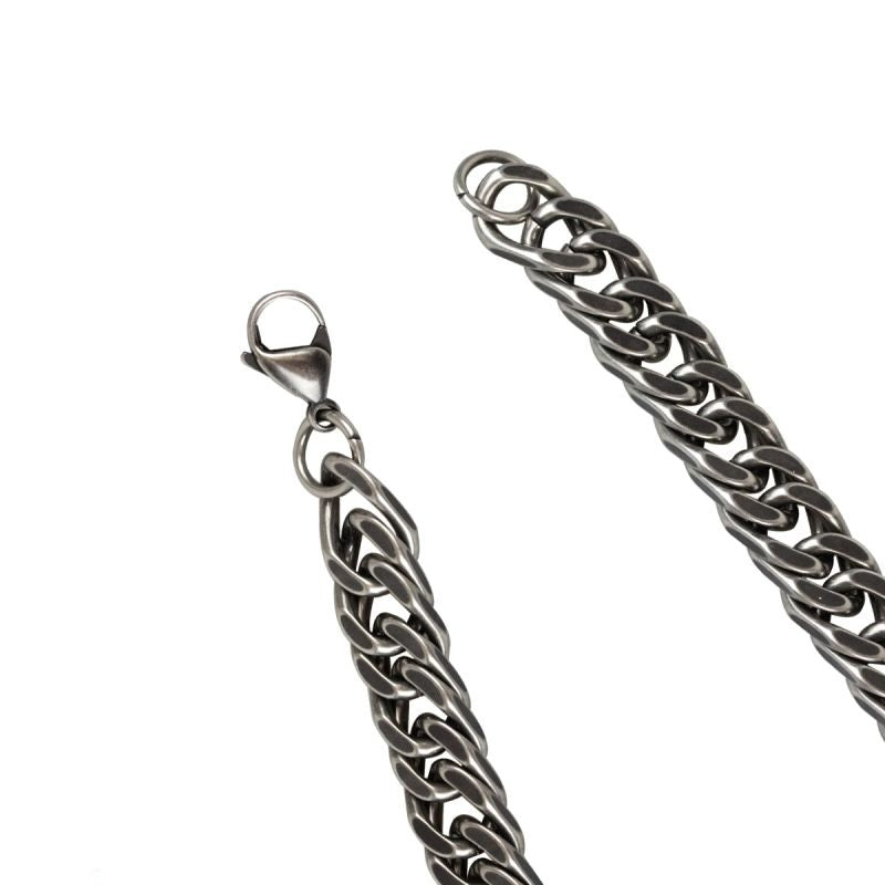 Stainless steel bracelet, oxidized finish, curb chain with lobster clasp. Width: 10 mm, Length: 20 cm.