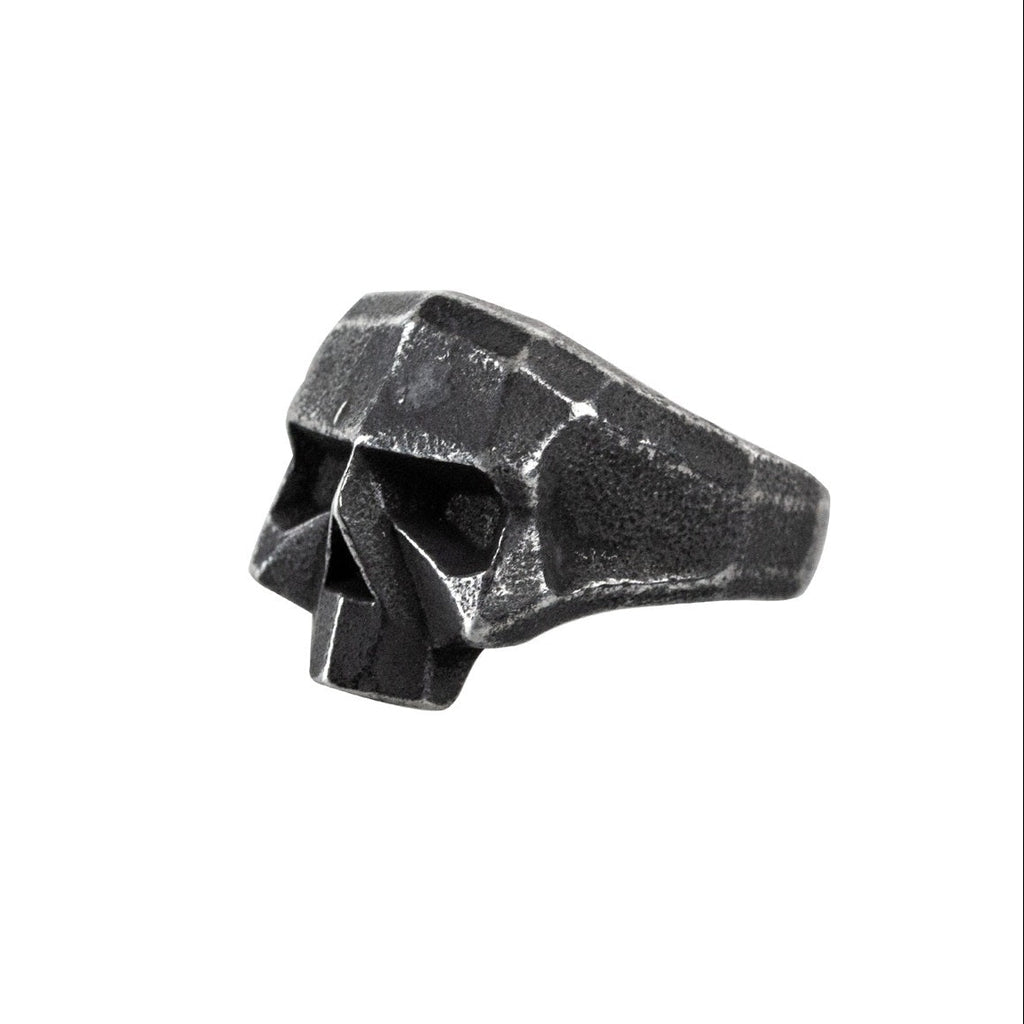 This ultra-cool "Dirty Skull" ring boasts a stainless steel oxidized hard rock style. Crafted with durable materials, this unique piece offers a bold and edgy look. Perfect for fans of rock and roll fashion, this ring is sure to make a statement