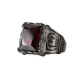 Stainless steel ring with large red, faceted stone and crown on the sides, Width: approx. 1.7 cm, Material: stainless steel with faceted zirconia.