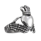 This traditional Irish wedding ring features a distinctive design of skeleton hands, symbolizing eternal love and loyalty. With a height of approximately 2.0 cm, it is a visually striking and meaningful addition to any alternative jewelry collection.