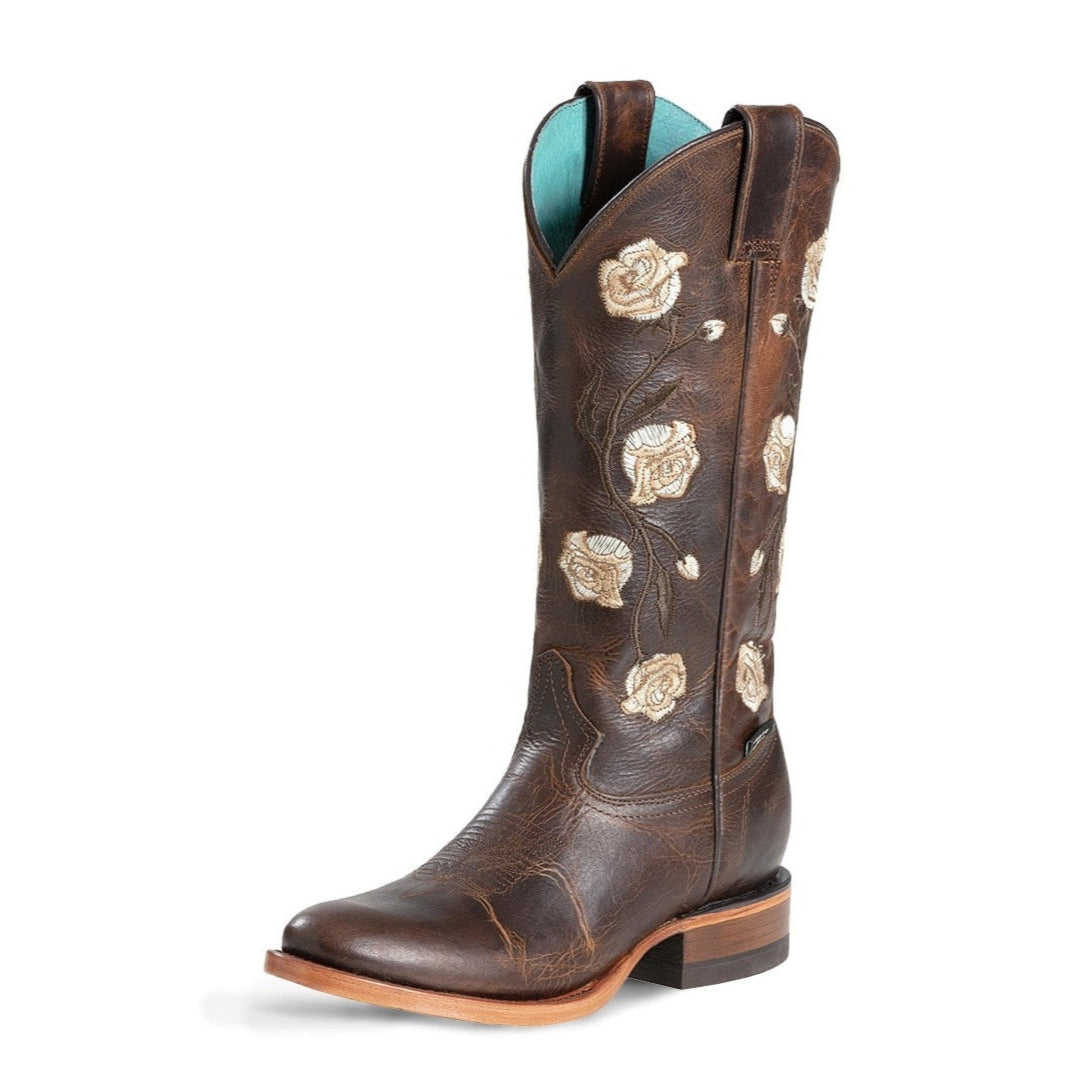 Brown cowboy boot with floral embroidery on a white background