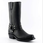 Premium Tall Black Leather Western Cowboy Boots. Discover the iconic Renegade Hi tall Western cowboy boots in black leather, a bold statement piece that fuses authentic Western heritage with rock and biker edge. These premium tall boots feature a commanding 29cm shaft, distinctive harness straps with O-rings, and versatile unisex styling that works for both men and women who demand boots with serious attitude.